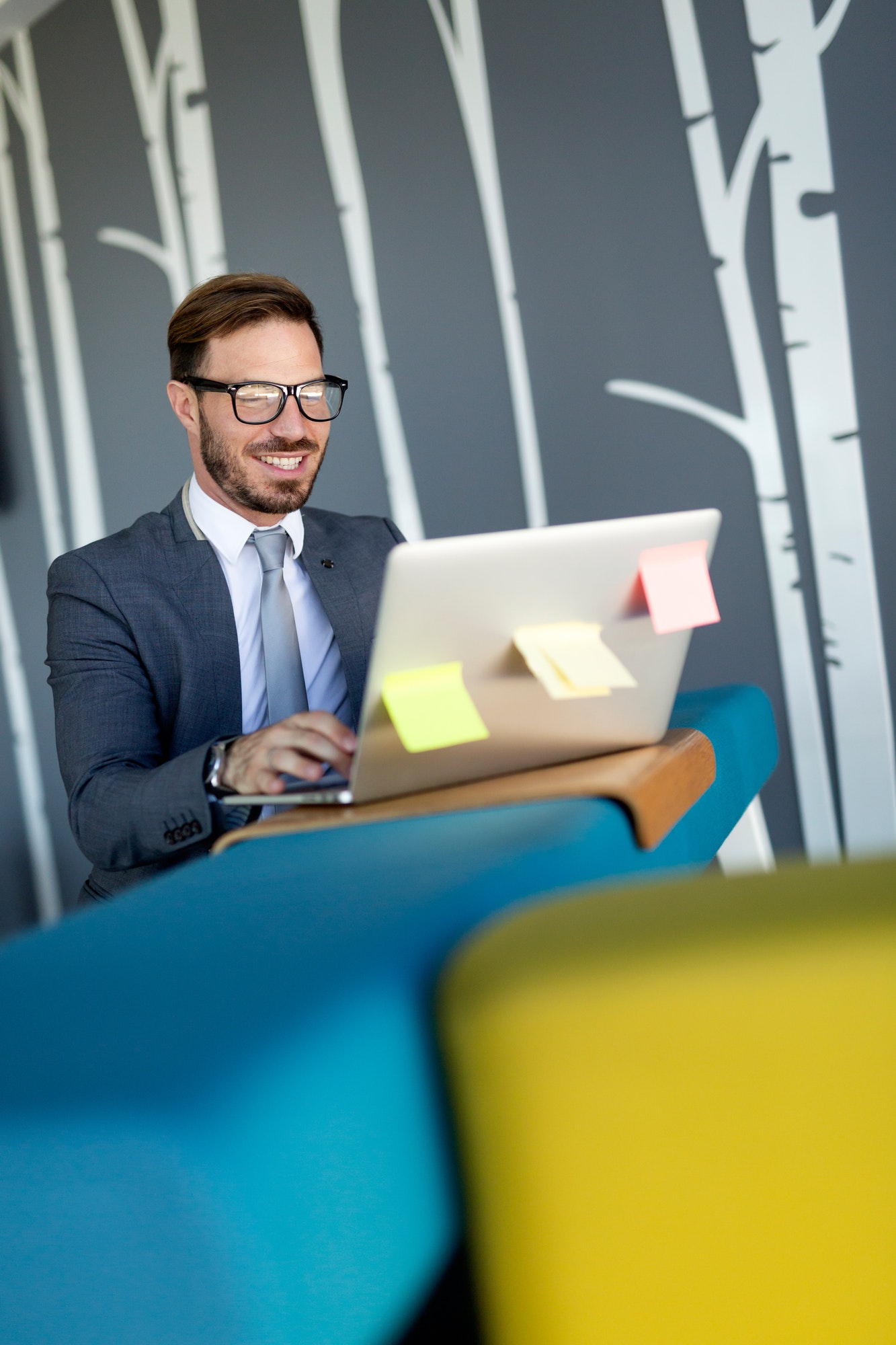 Young employee working on computer during working day in office